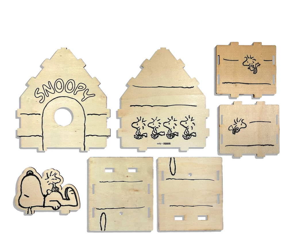 Wooden puzzle pieces with Snoopy and Woodstock designs when pieced together make up the birdhouse that can be colored in with the included paint markers. 