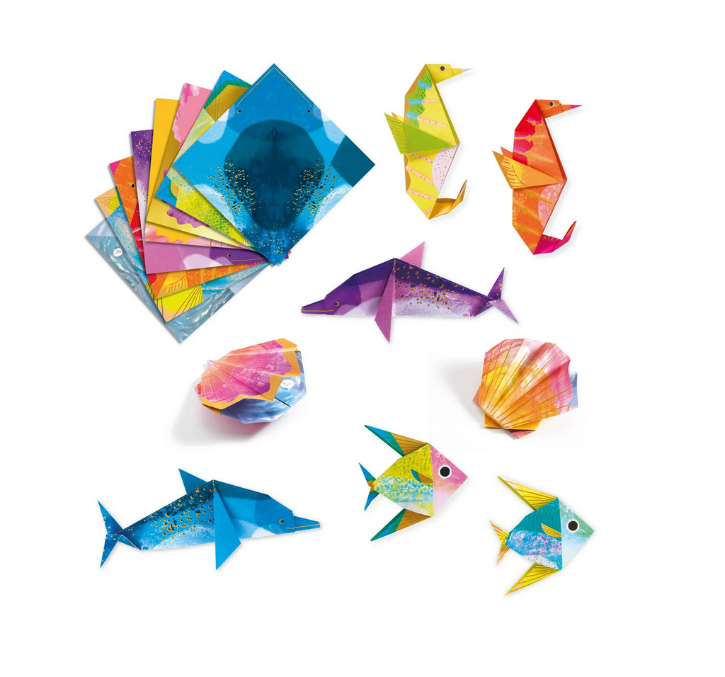 Sheets of colorful origami paper and sea creatures made with the paper. 