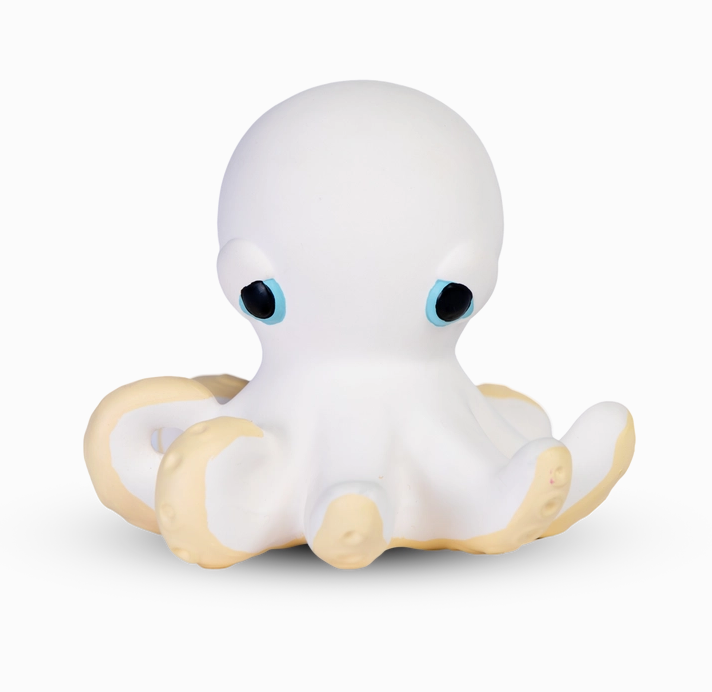 Orlando the Octopus white octopus toy with blue eyes and pale yellow under his tentacles. 