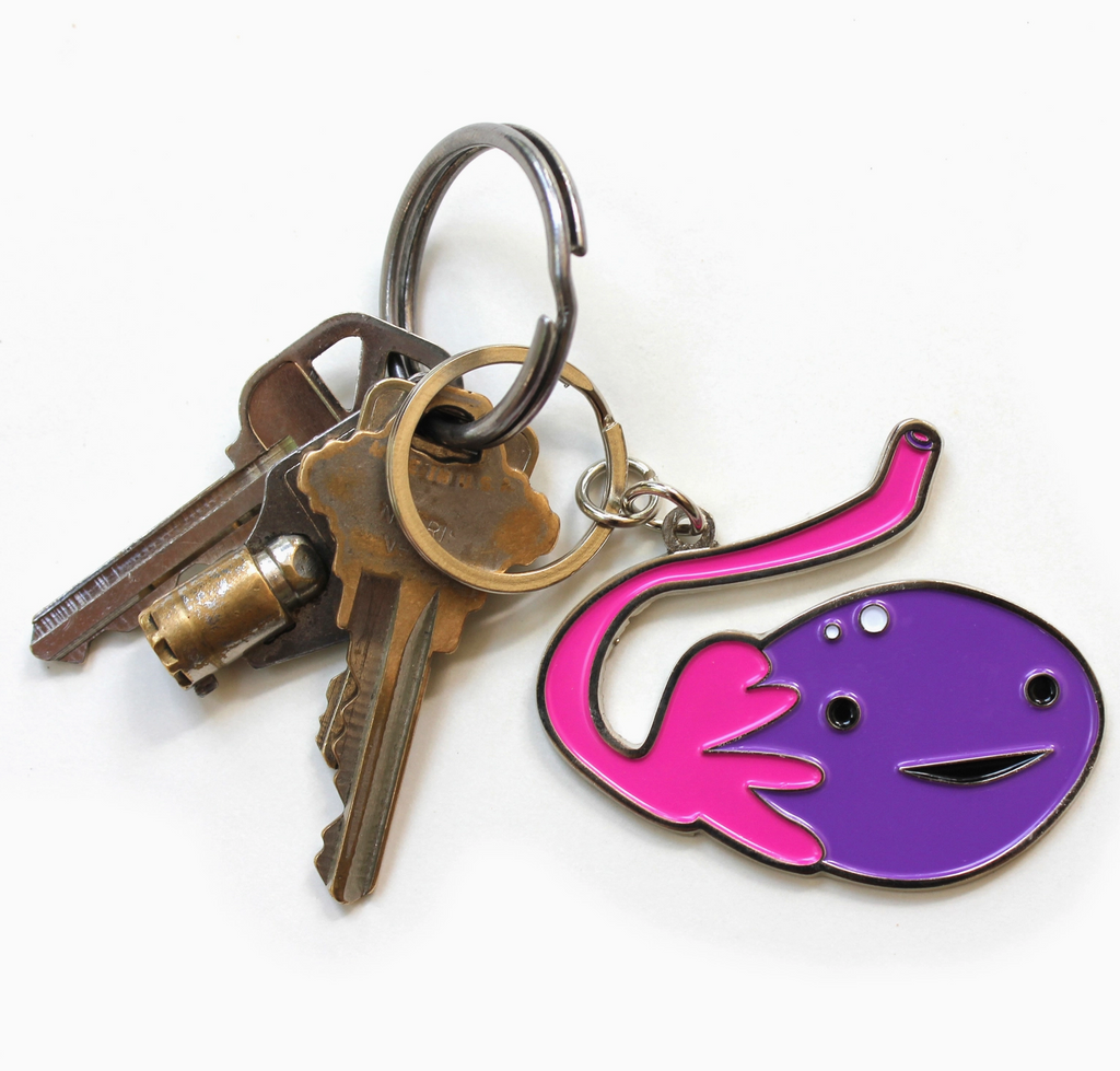 Purple Ovary shaped enamel keychain with keys attached.