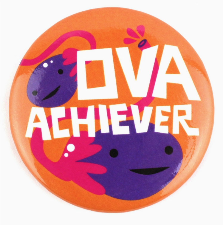 Round magnet with orange background with illustrated purple and pink ovaries with Ova Achiever written in white lettering.