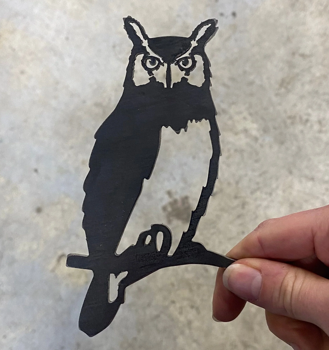 Shilouette of an owl made from metal.