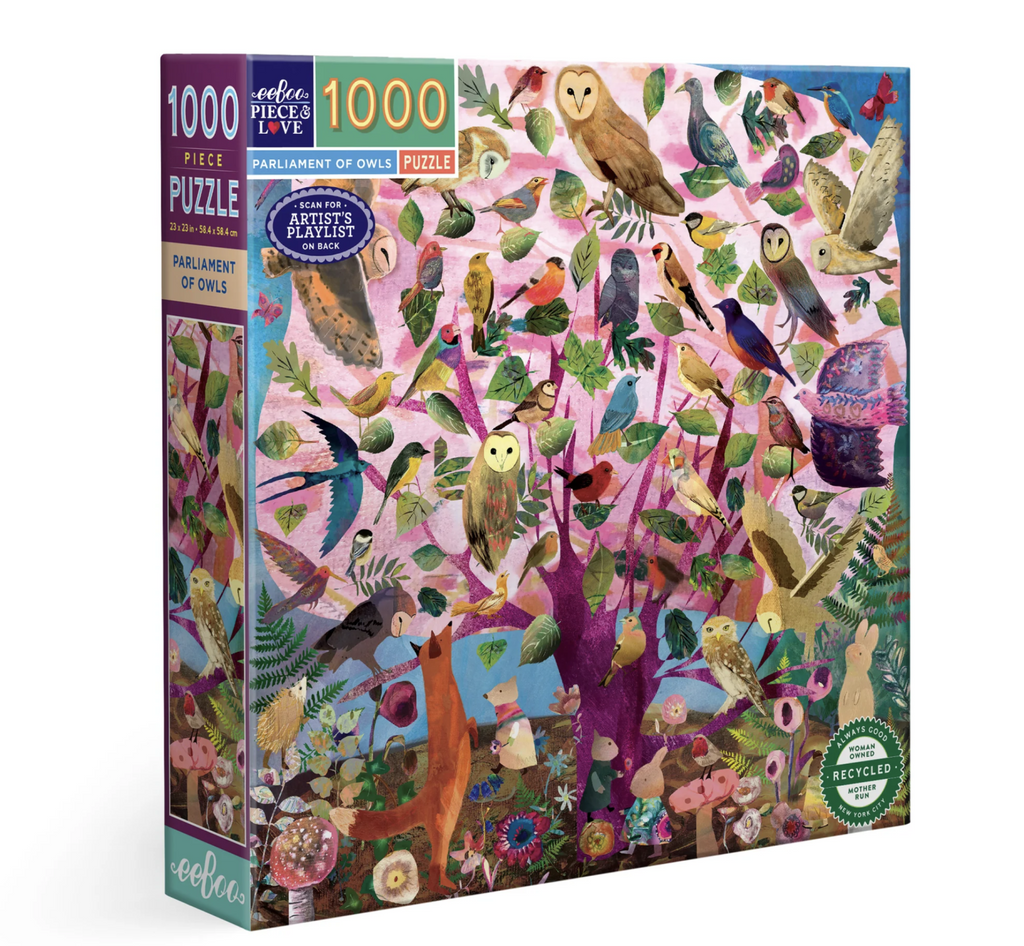 Parliament of Owls 1000 piece puzzle box features the illustration of a purple tree full of owls and other birds with a fox and more forest creatures on the ground below.
