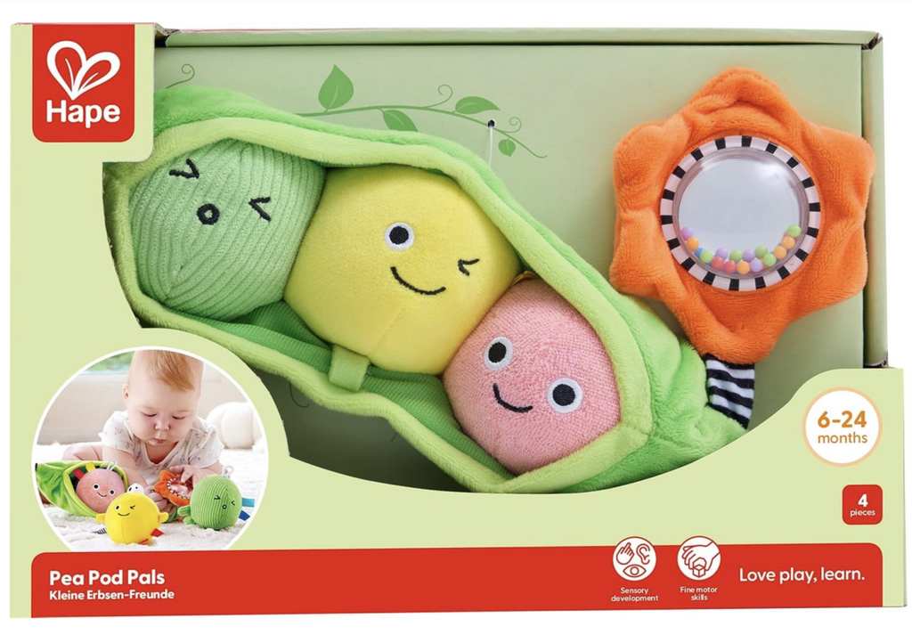 The Pea Pod Pals from Hape packaged in an open box to allow everyone to feel the different textures and hear the multiple chimes and sounds made by the individual peas. 