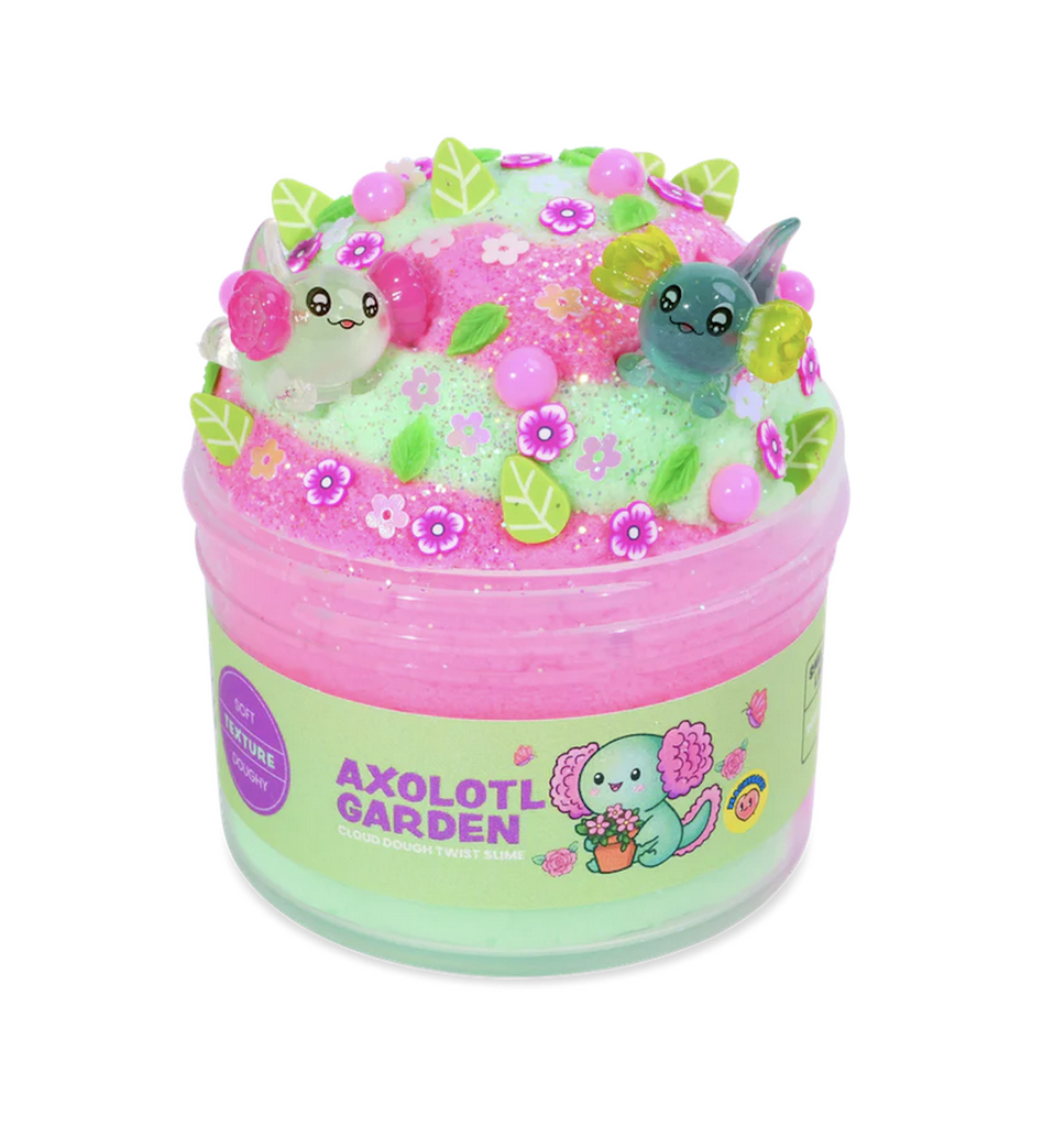 Peachybbies Axolotl Garden Slime packed in a clear tube that shows the bright pink and lime green slime swirled with axolotl pink pearls, green leaves, and pretty flower charms. 