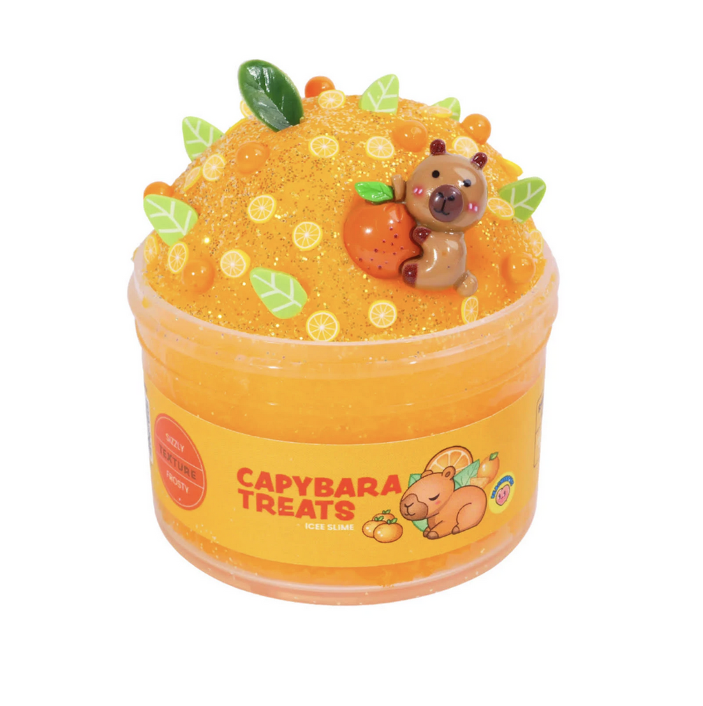 Peachybbies Capybara Treats Icee slime in a clear container that shows the textured, orange slime with a capybara charm, and sprinkles in the shape of leaves and orange slices. Not food, do not eat. 