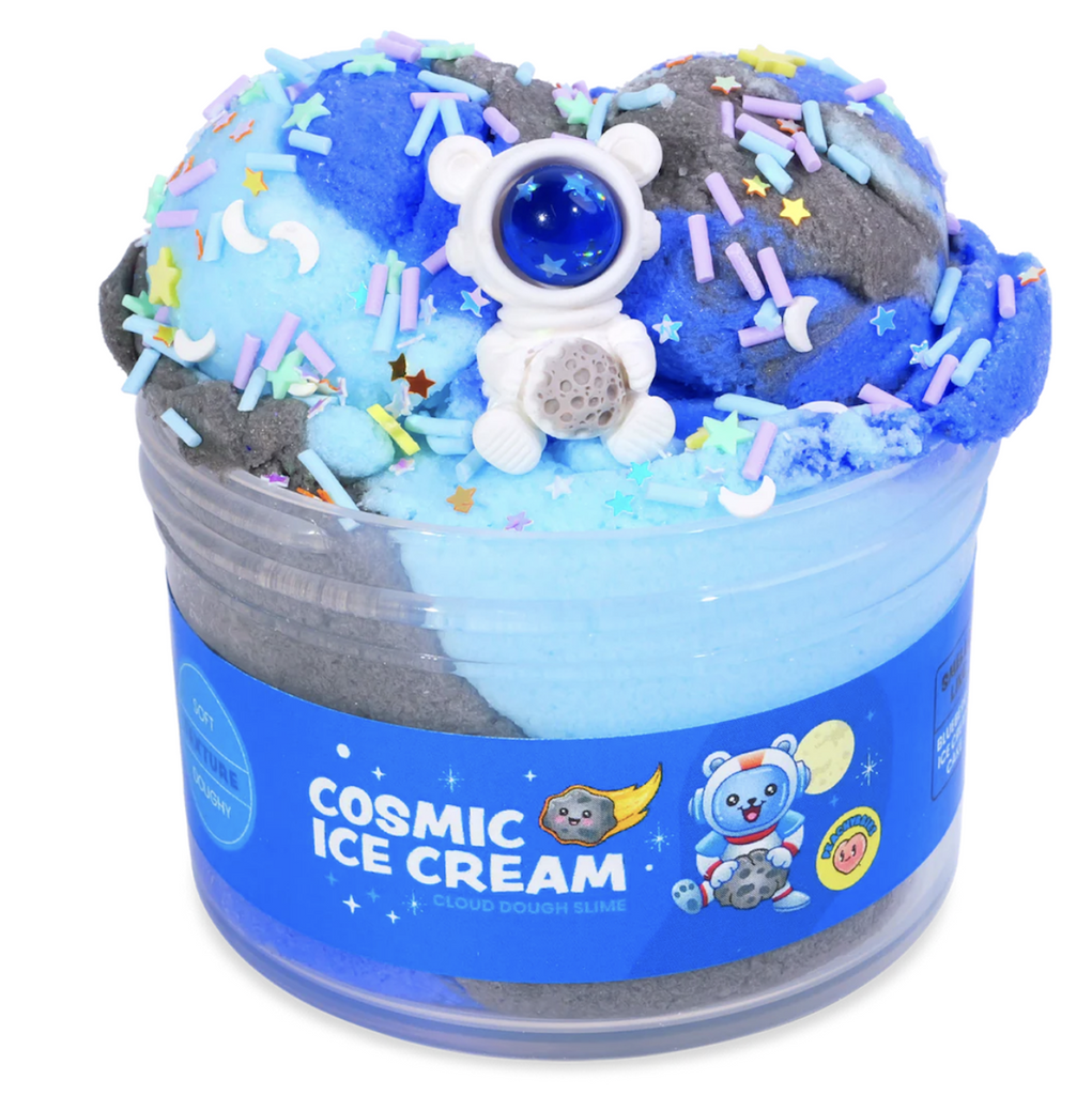 Peachybbies Cosmic Ice Cream slime in a clear container that shows the cloud slime in dark blue, baby blue and grey colors. There is an astronaut charm with multicolored confetti sprinkles to mix in. Not food, do not eat. 