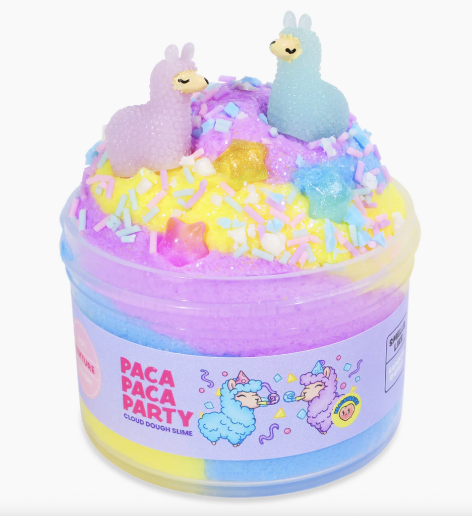 Pastel purple, blue and yellow cloud slime piled high in a clear container with alpaca and star charms and pink, blue and white confetti sprinkles. 