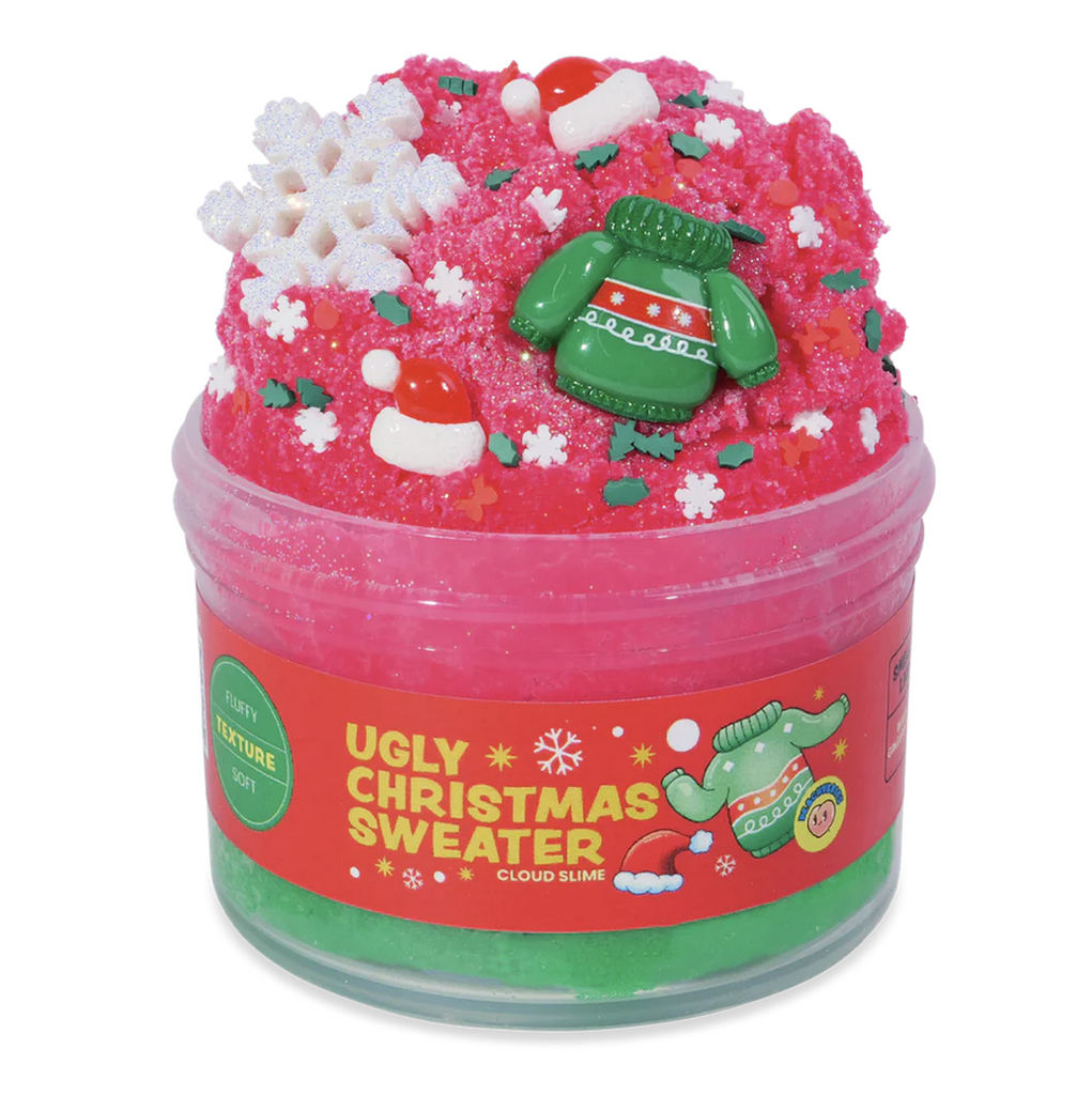 Red, cloud, slime piled high in a clear container with a green sweater charms,Santa hats and snowflake and Christmas tree confetti sprinkled throughout. Not food, Do Not Eat. 