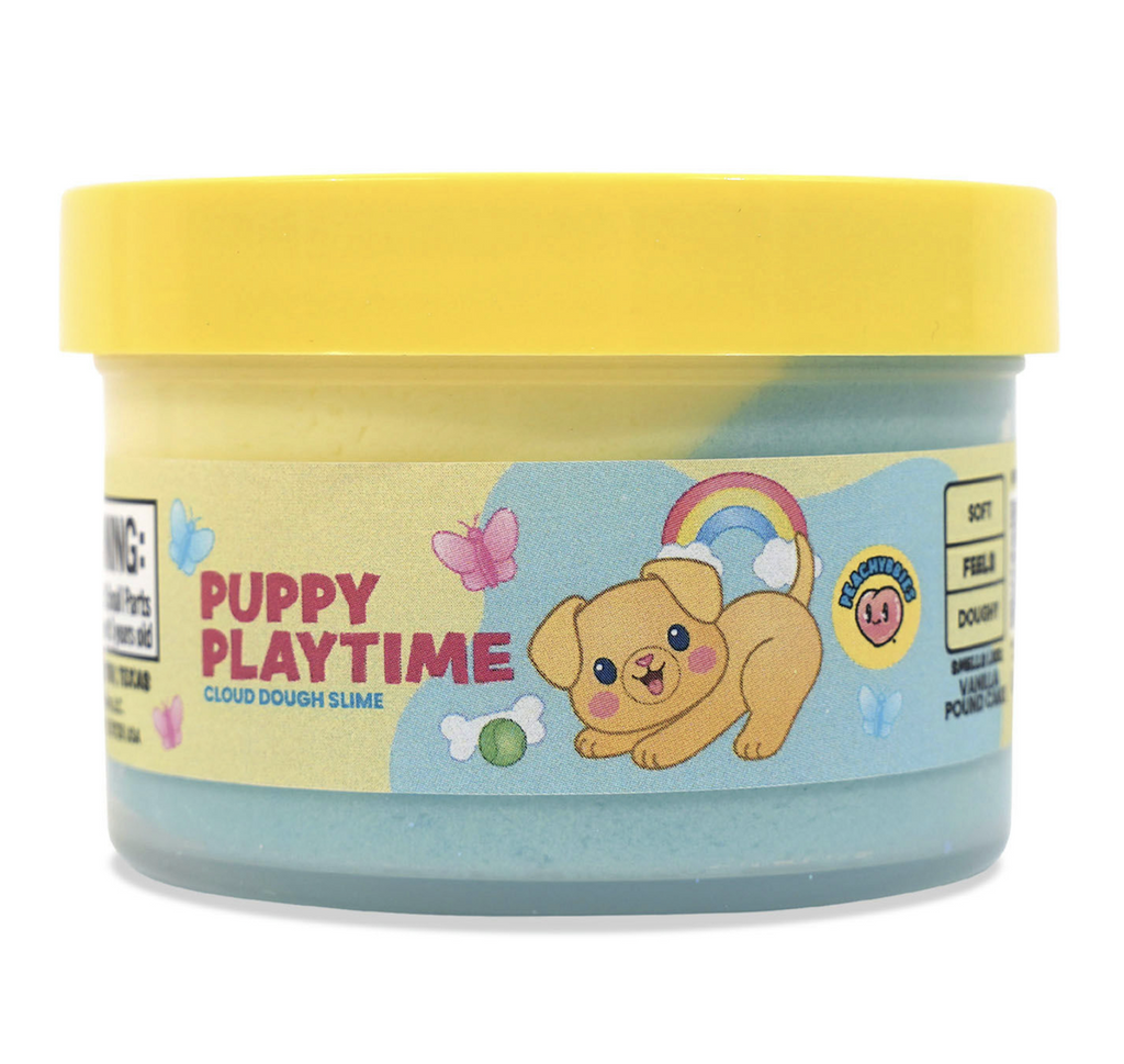 A clear container with a yellow top and label with an illustration of a cute puppy, a rainbow and butterflies, that reads Puppy Playtime Cloud Dough Slime. 