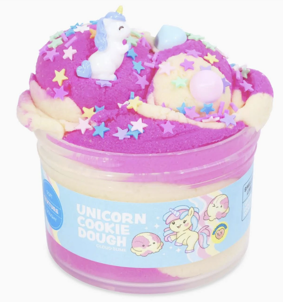 Peachybbies Unicorn Cookie Dough Slime piled high in a clear plastic tub that shows the hot oink and white colored slime with unicorn and pearl charms and colorful hearts and star sprinkles. 