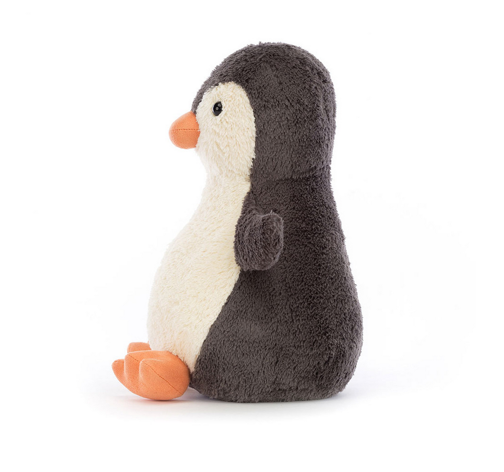 Side view of large peanut penguin plush.