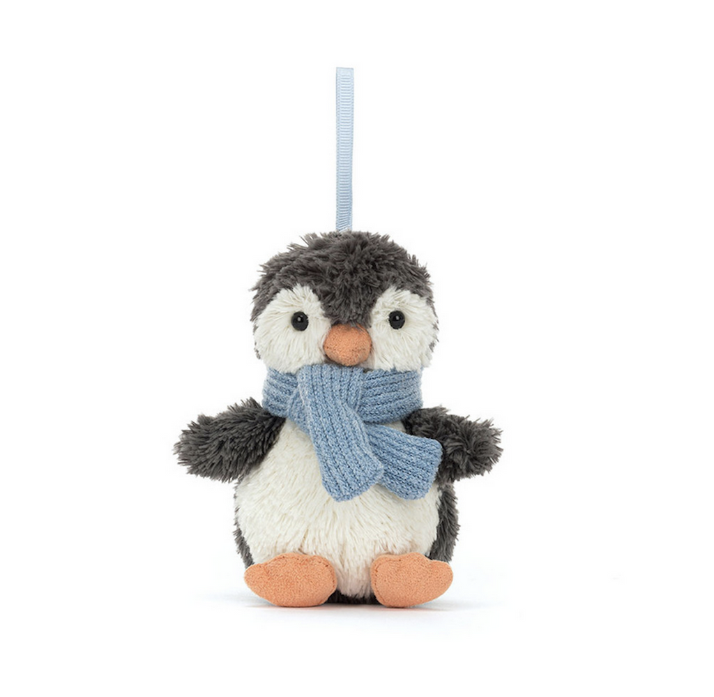 Plush Peanut Penguin by Jellycat wearing a soft blue scarf for warmth and cuteness! There is a blue ribbon so you can hang him from a holiday tree or anywhere. 