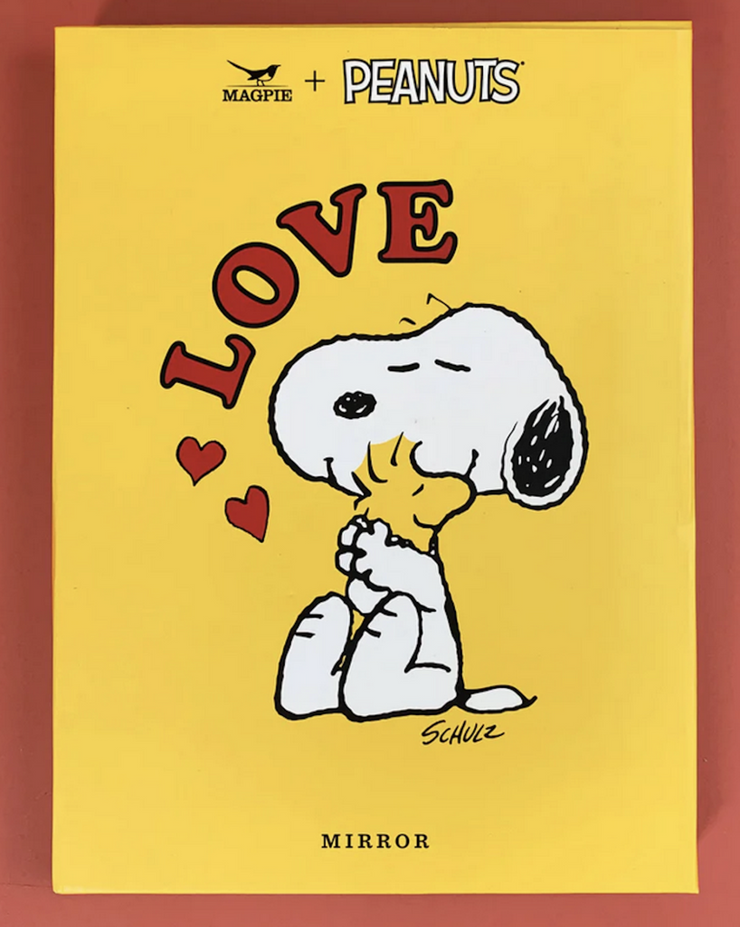 Bright yellow box with illustration of Snoopy and Woodstock hugging with Love written in red letters. 