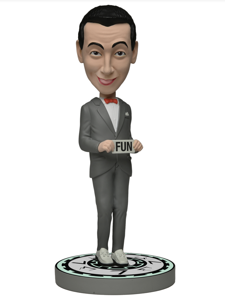 Pee Wee Herman dressed in his classic grey suit and red bowtie holding the word of the day "FUN". This figure has a slightly larger head that wobbles. 