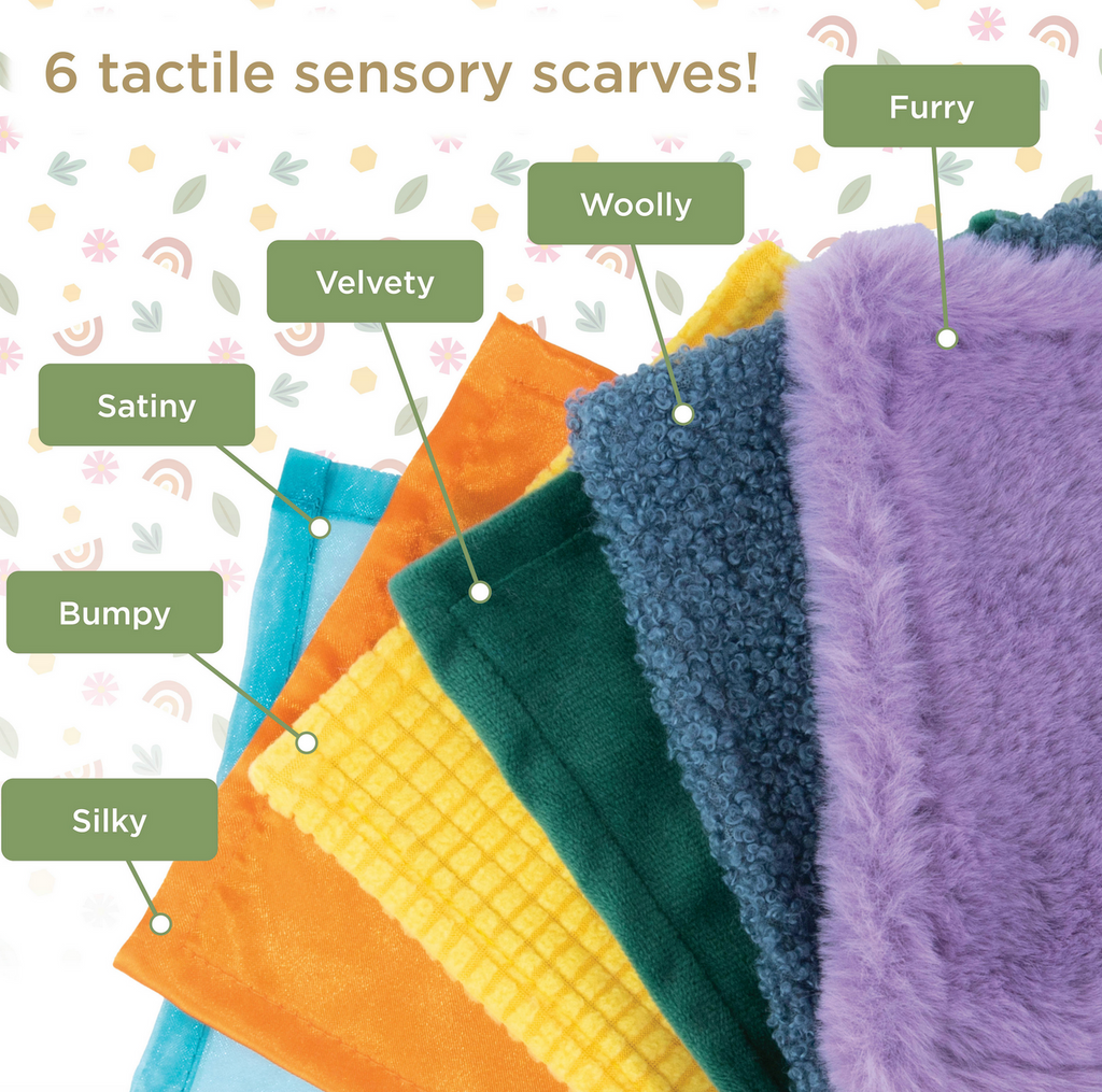 Each of the six scarves laid out to show the different colors and textures for baby to explore while playing with the Peek and Pull Baby Tissue Box. 