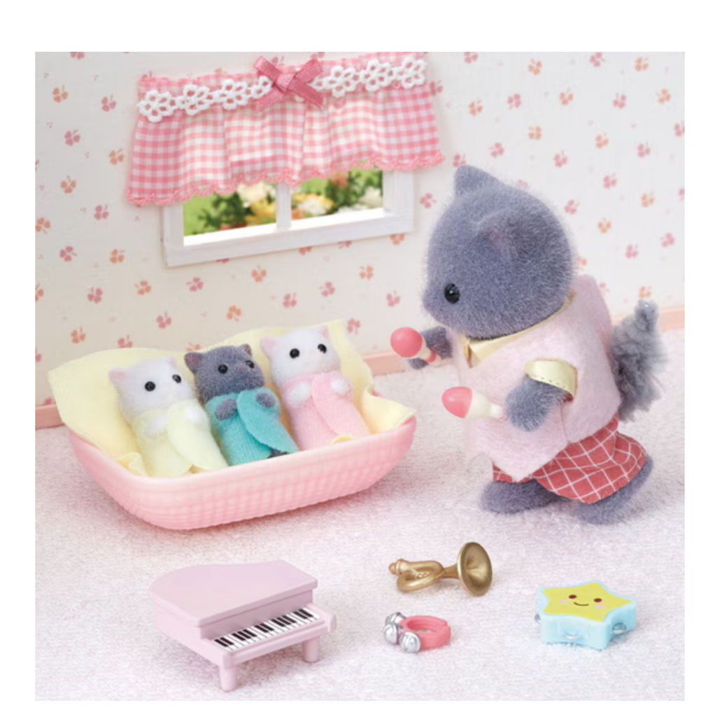 Calico Critters Persian Cat Triplets in their cradle being entertained by their brother playing music for them.