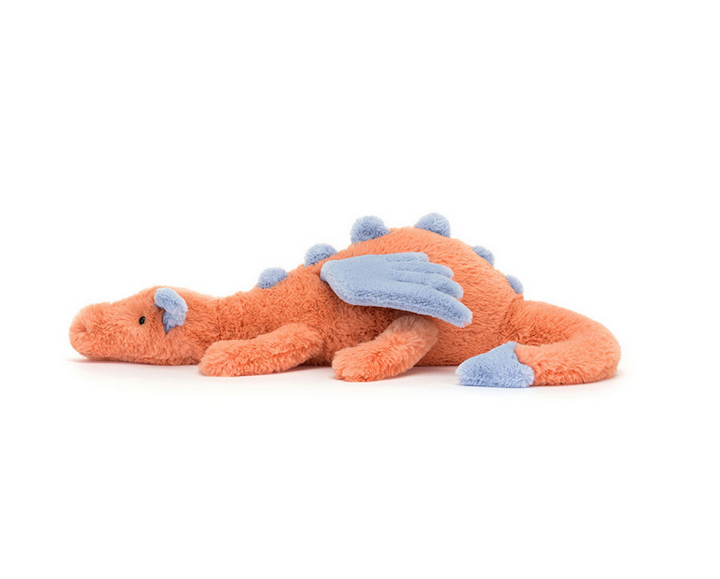 Persimmon Dragon plush toy viewed from the side. 