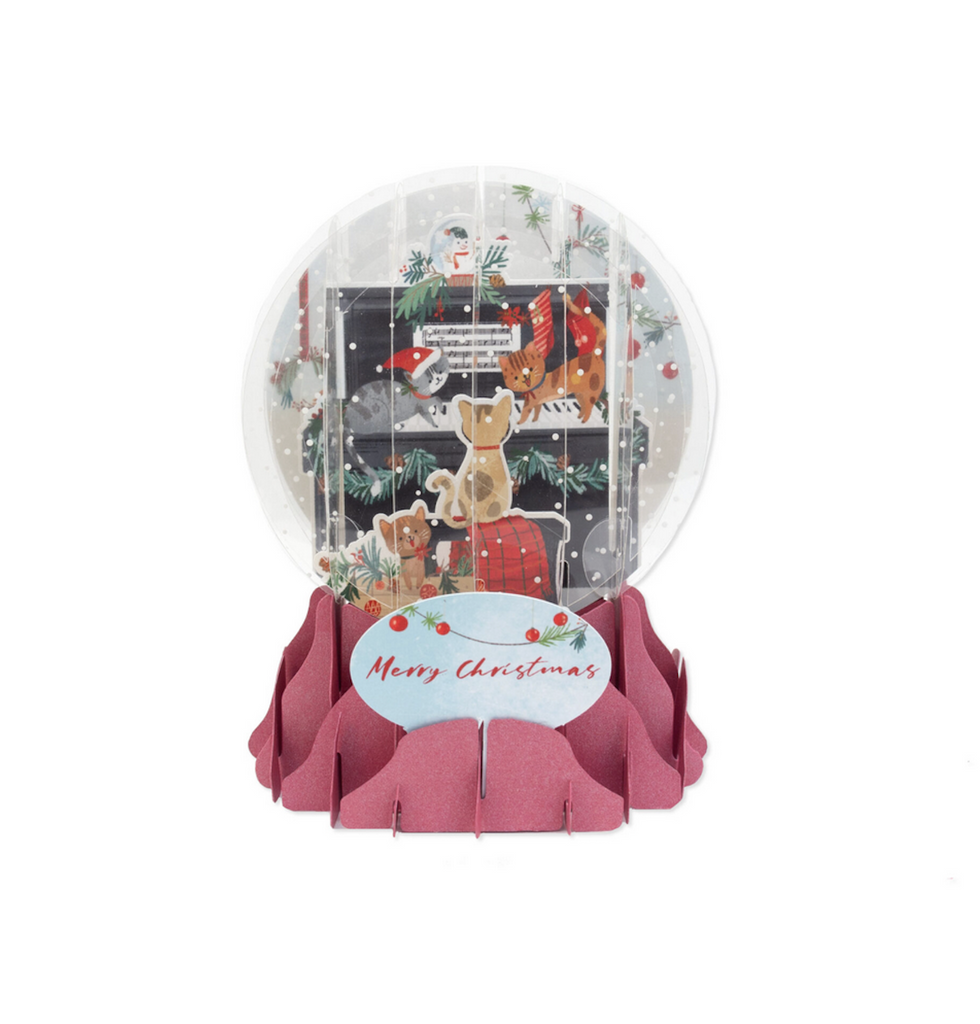 Pop up snow globe greeting card with kitties all over a piano. With "Merry Christmas" as the greeting. 