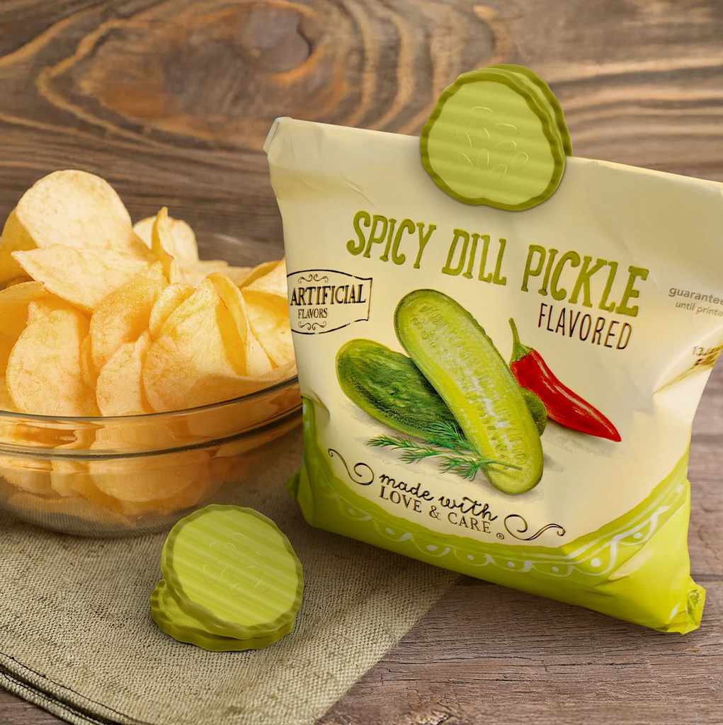 A bag of potato chips closed using the Pickle Clips. 