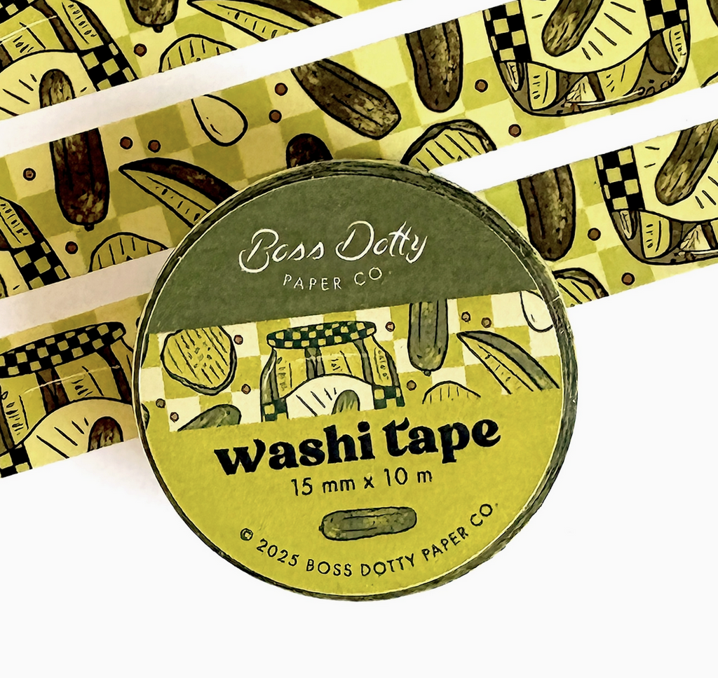 Roll of pickle themed washi tape, with a label featuring a jar of pickles, pickle spears and pickle chips. 