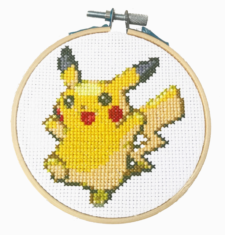 The completed Pikachu cross stitch pattern within the wooden hoop that comes with the set. 