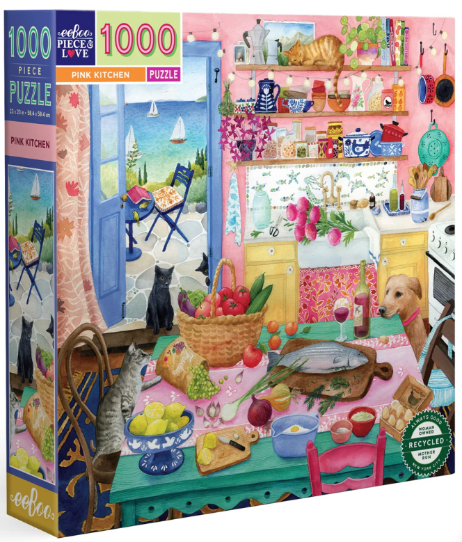 Cover of the box for Pink Kitchen 1000 Piece puzzle. It has a picture of a lovely kitchen with pink walls and lots of  dogs and cats. 