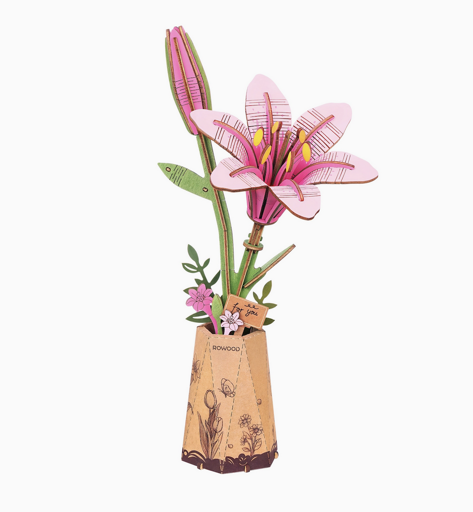 Completed Pink Lilly wooden 3D flower puzzle. With one bloom that has opened and one bloom that will open soon. 