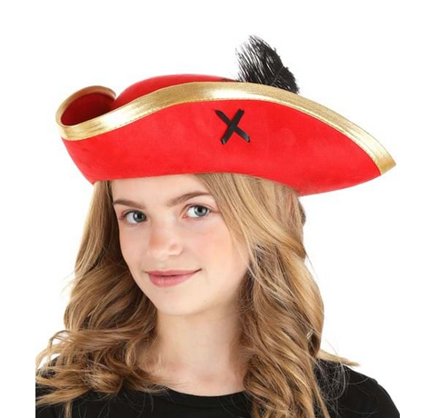 A tricorn-style hat that is made out of red faux suede and trimmed with metallic gold edging. Each side is stitched with "x marks the spot" black ribbon and a matching black feather sticks up from the inside of the brim. A child is wearing it in this picture. 