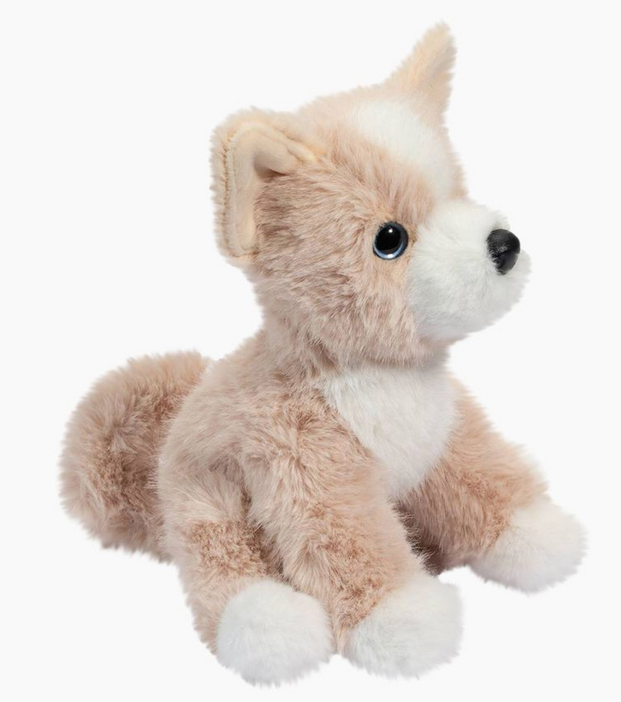 Side view of Pookie Pomsky stuffed dog with light tan plush fur and white chest, nuzzle and paws. 