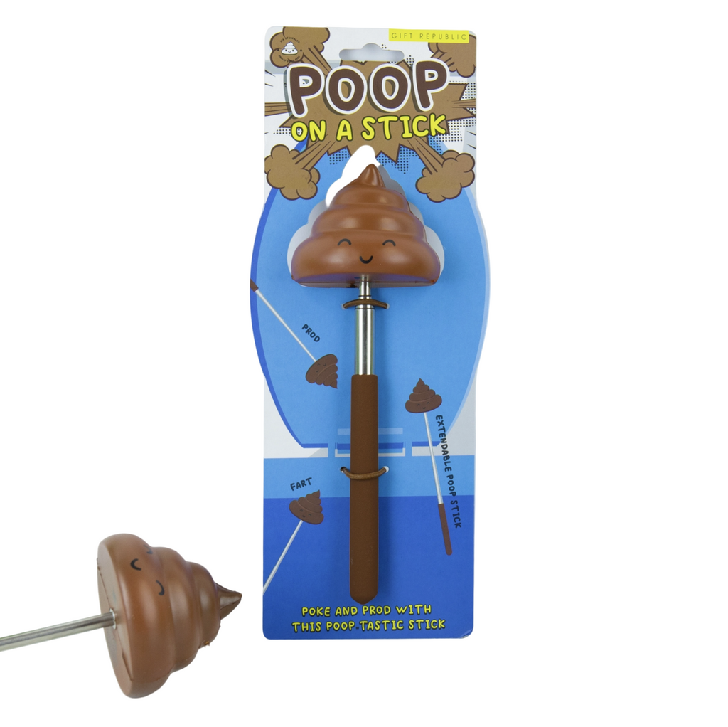 Foam poop on a stick next to it's packaging o a white background