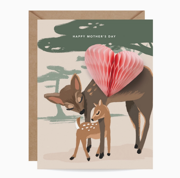 Greeting card with a momma deer snuggling a baby deer and a pop up pink 3d heart. It reads "Happy Mother's Day"