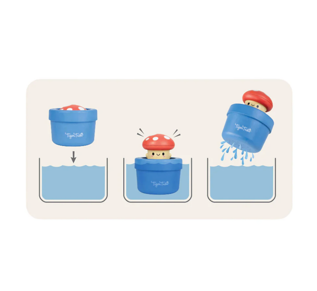 Bath toy with a blue container and a red mushroom character on a white background