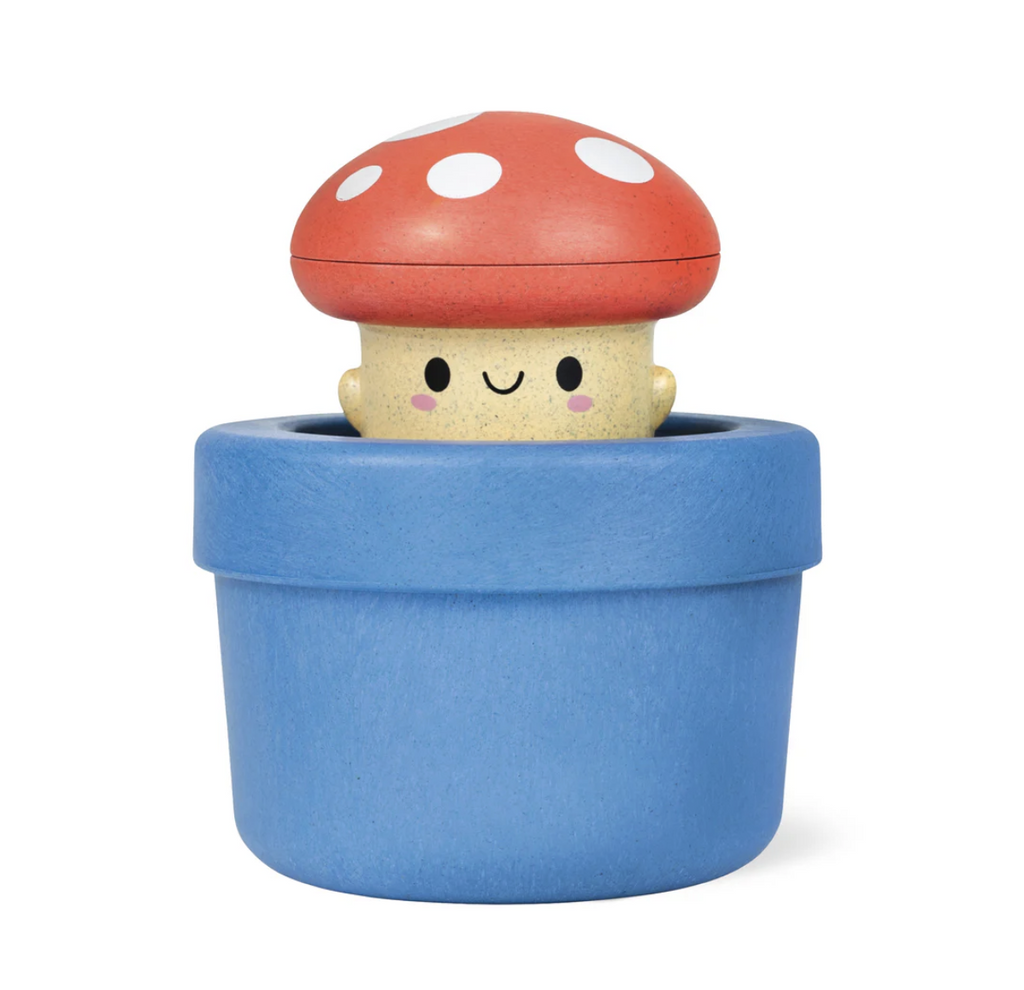 Red capped mushroom toy in a blue base bath toy.