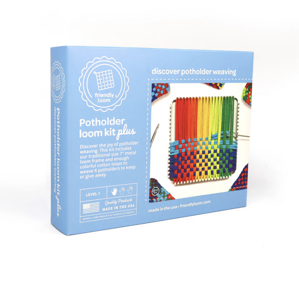 Blue box containing the Potholder Loom Kit Plus, with a picture of a potholder being woven on the loom and a brief description on the front. 