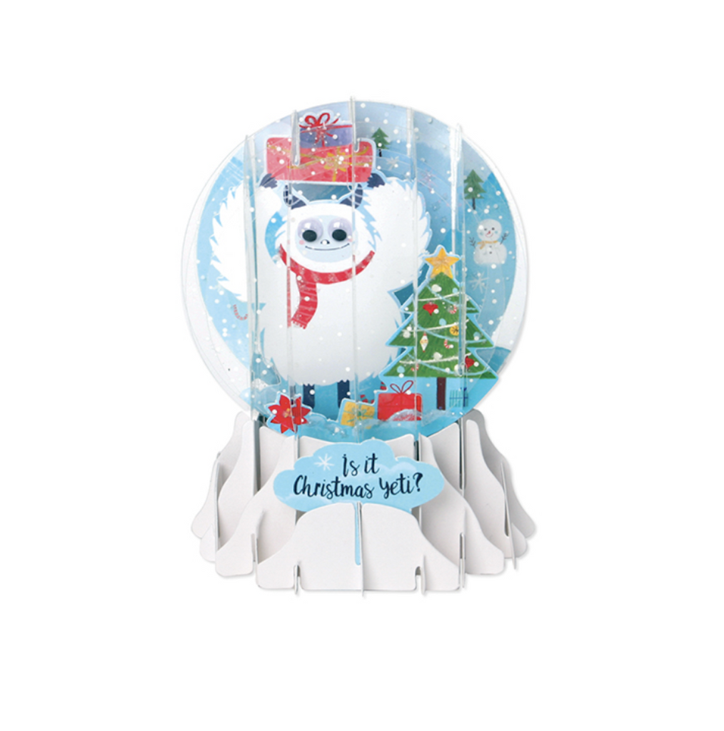 Pop up snow globe greeting card with a Yeti holding presents around a Christmas tree. with "Is it Christmas Yeti?" written on the front. 