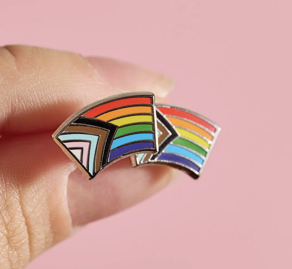 Post earrings of the Progress Pride Flag this flag includes black and brown stripes to represent marginalized LGBTQ+ communities of color, along with the colors pink, light blue and white, which are used on the Transgender Pride Flag