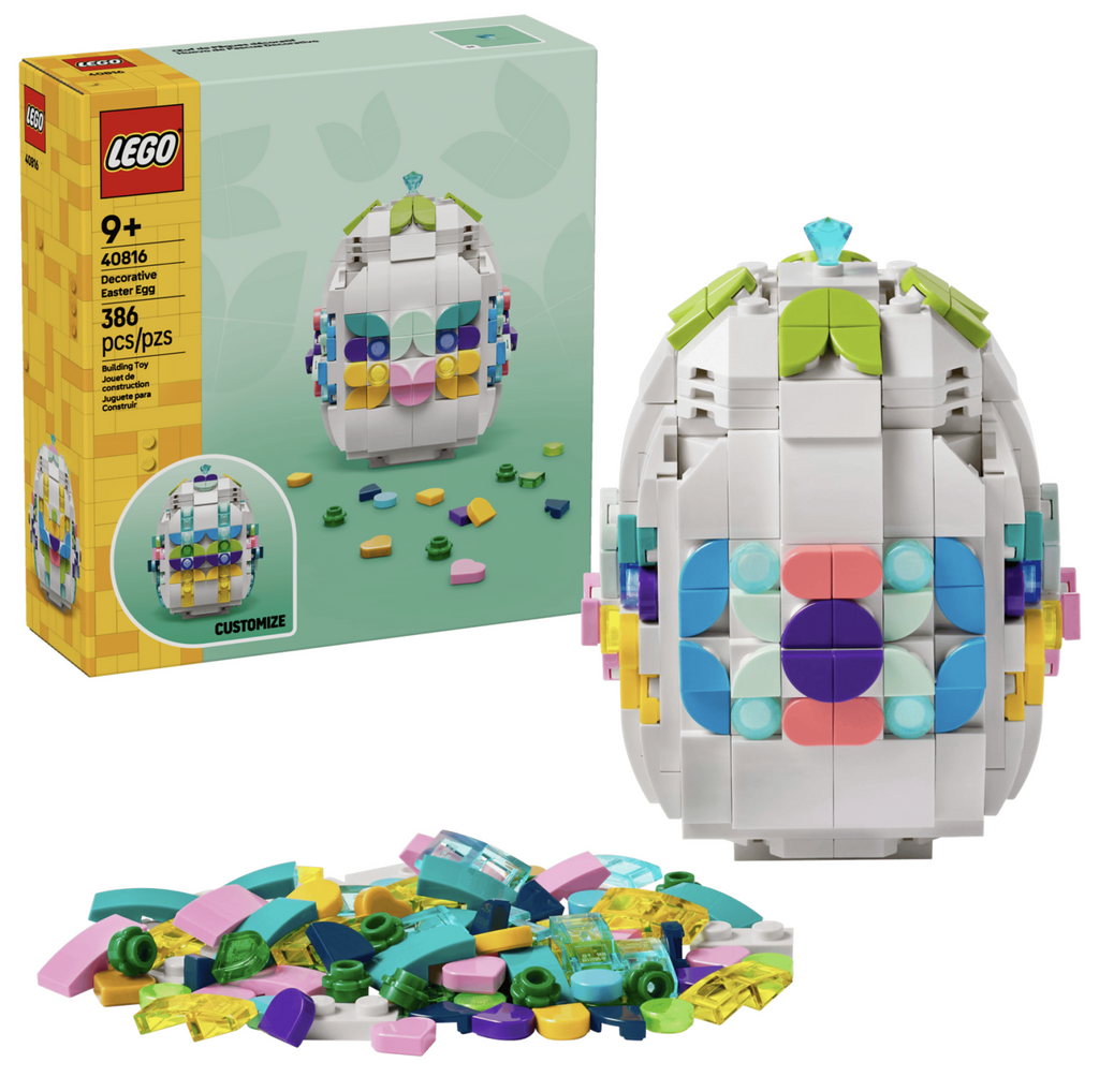 LEGO Decorative Easter Egg building set packaged in a box that features a picture of the egg built and in the process of being decorated. The Decorative Egg and a pile of colorful LEGO pieces are in the foreground in front of the box.