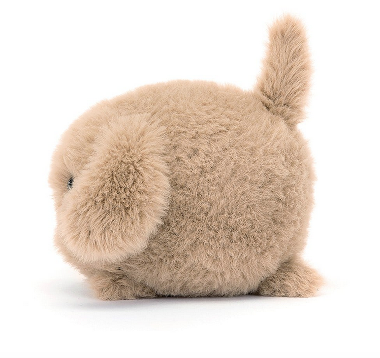 Plush little Puppy Caboodle from the side, It's tail is sticking straight uo and it's body is as round as a ball. 