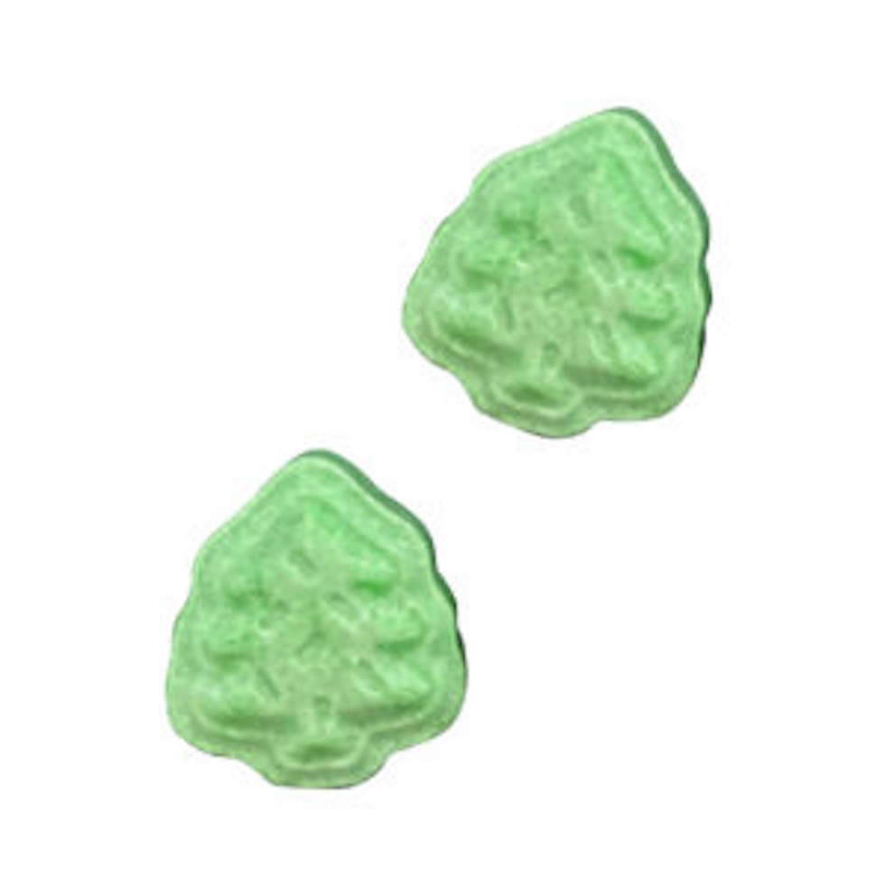 Green tree shaped sour apple flavored candies from the Pusheen Meowy Christmas tin. 