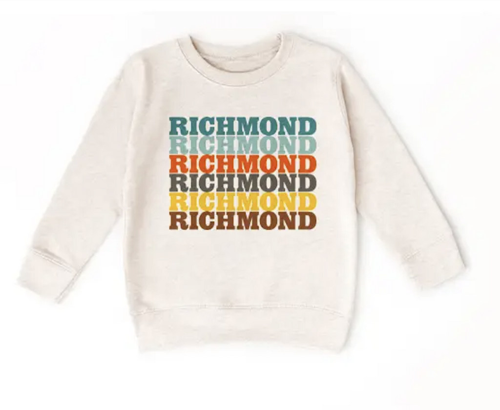 Oatmeal heather grey toddler sweatshirt with the word Richmond repeating down the front in warm toned colors. Size 3T