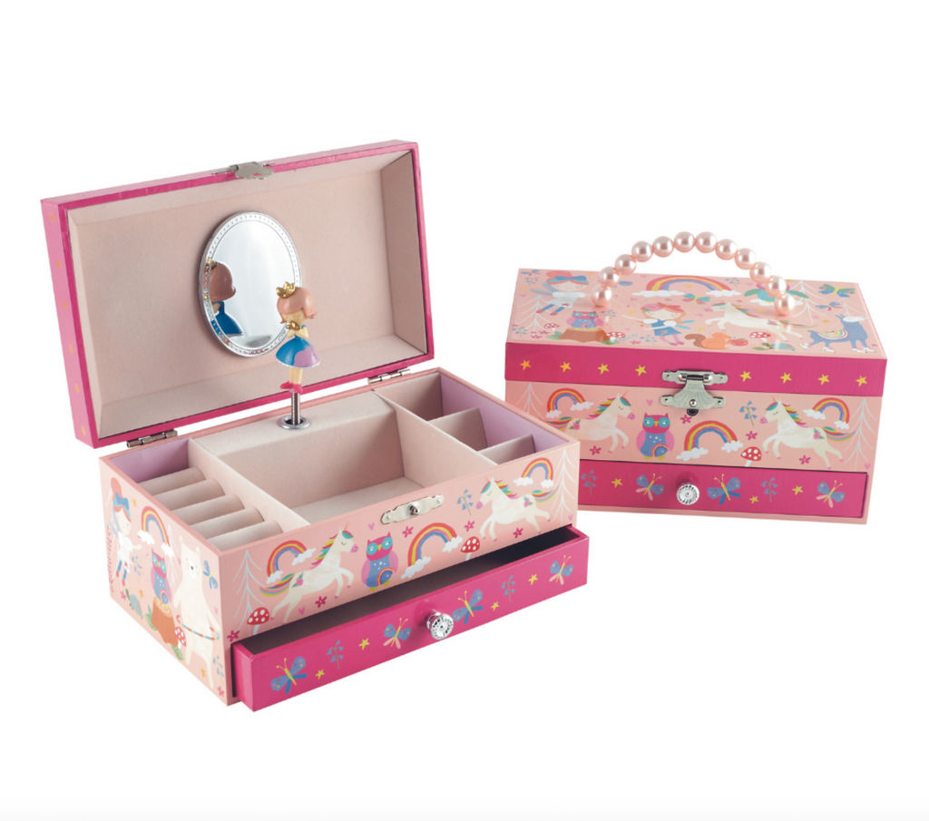 The Rainbow Fairy Jewelry Box is pink with mirror and compartments on the inside with a ballerina figurine that turns when the box is opened. 