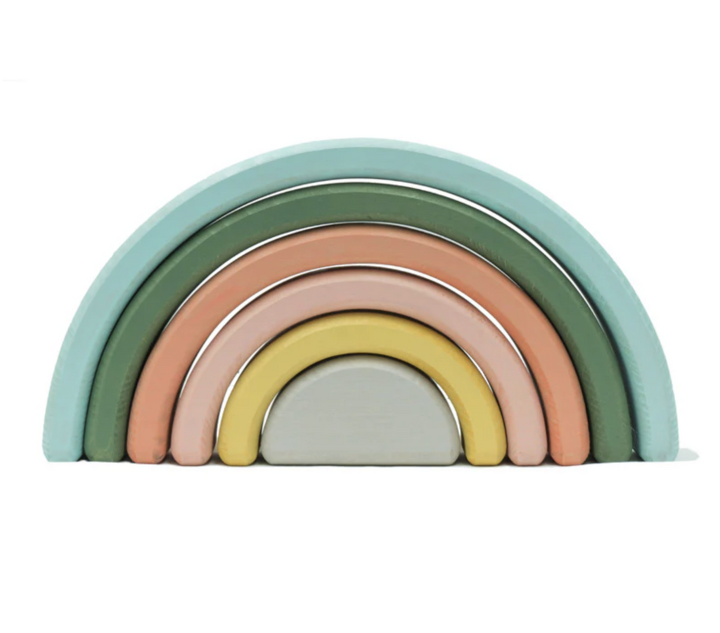 Pastel colored rainbow nesting blocks in the shape of a rainbow from smallest to largest. 