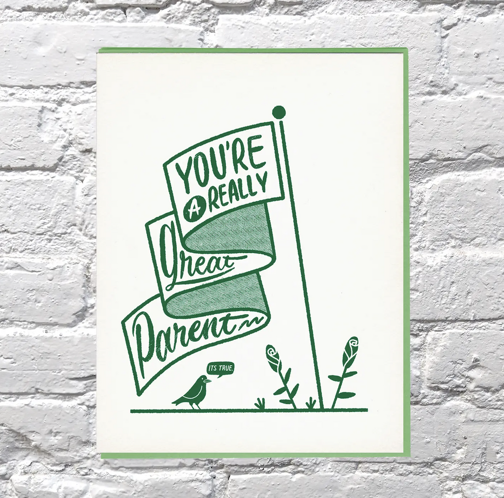 Illustrated greeting card of a banner that reads " You're A Really Great Parent" in green lettering. Perfect for the non binary parent. 