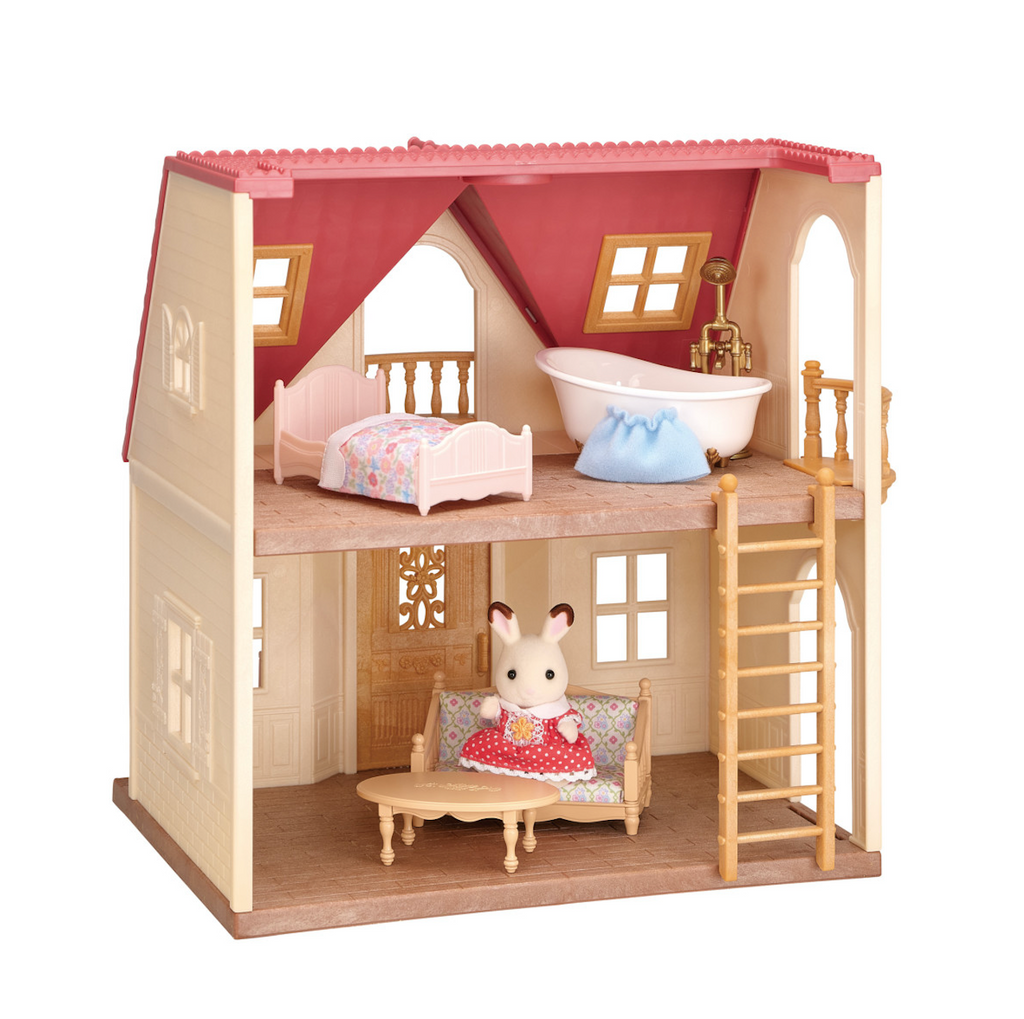 View of the back of the house which is open and has two levels, the living room with Freya the Chocolate Rabbit figure sitting on the couch a ladder leading upstairs to the pink bed and white bathtub. 