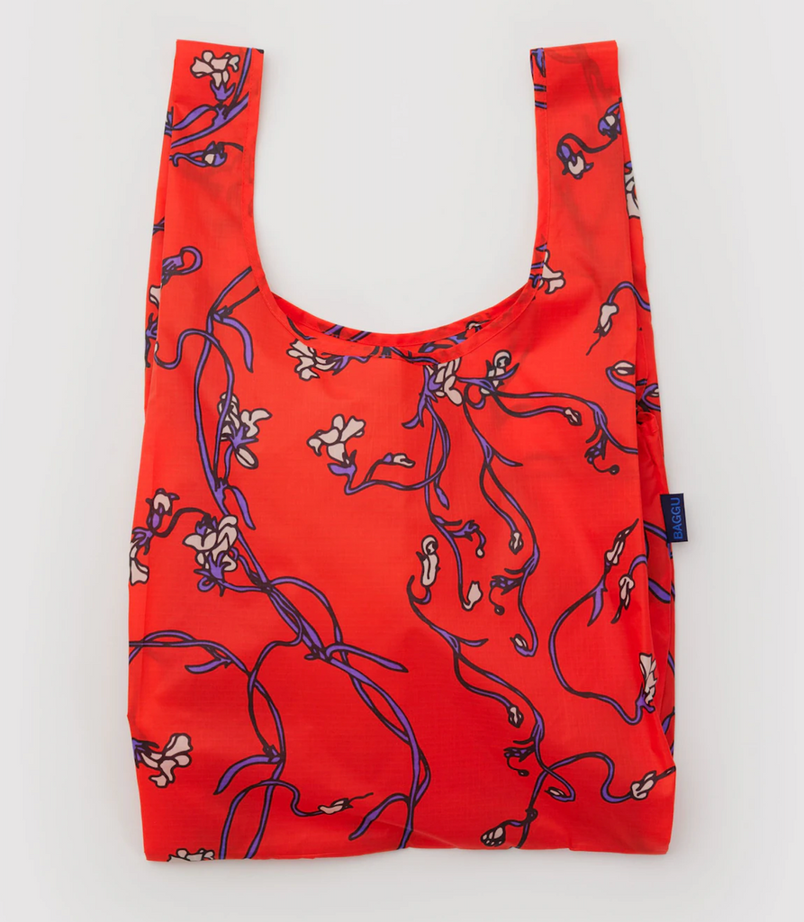 Red reusable Baggu bag with floral snapdragon pattern. 