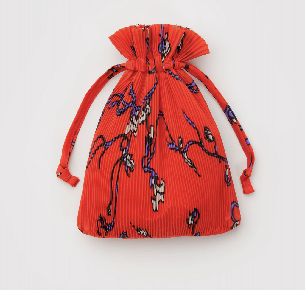 The Red Snapdragon Pleated Baggu bag inside the matching pouch it can be stored in. 