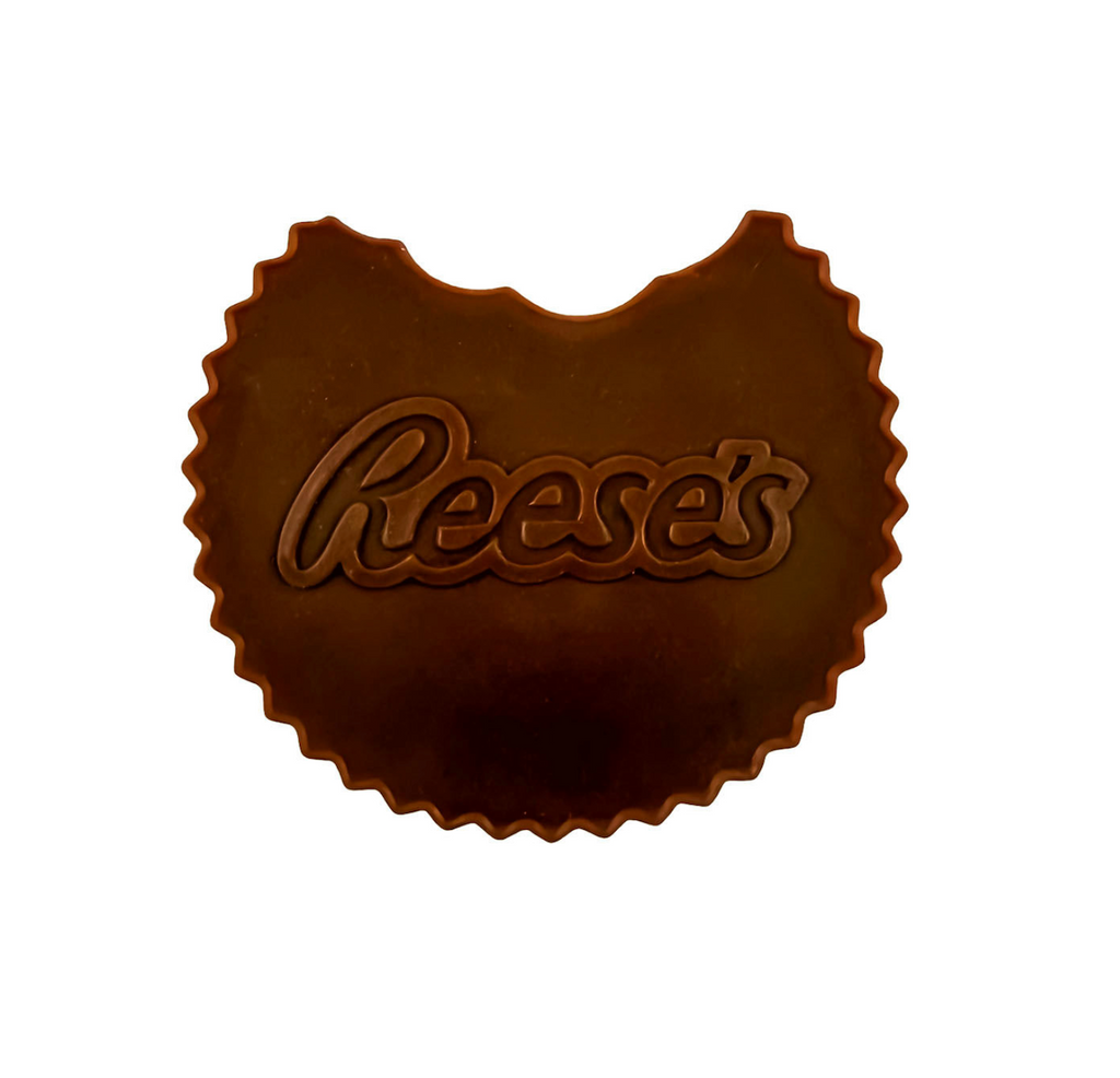  Reese's-shaped scented squishi toy with a bite taken out of it. 