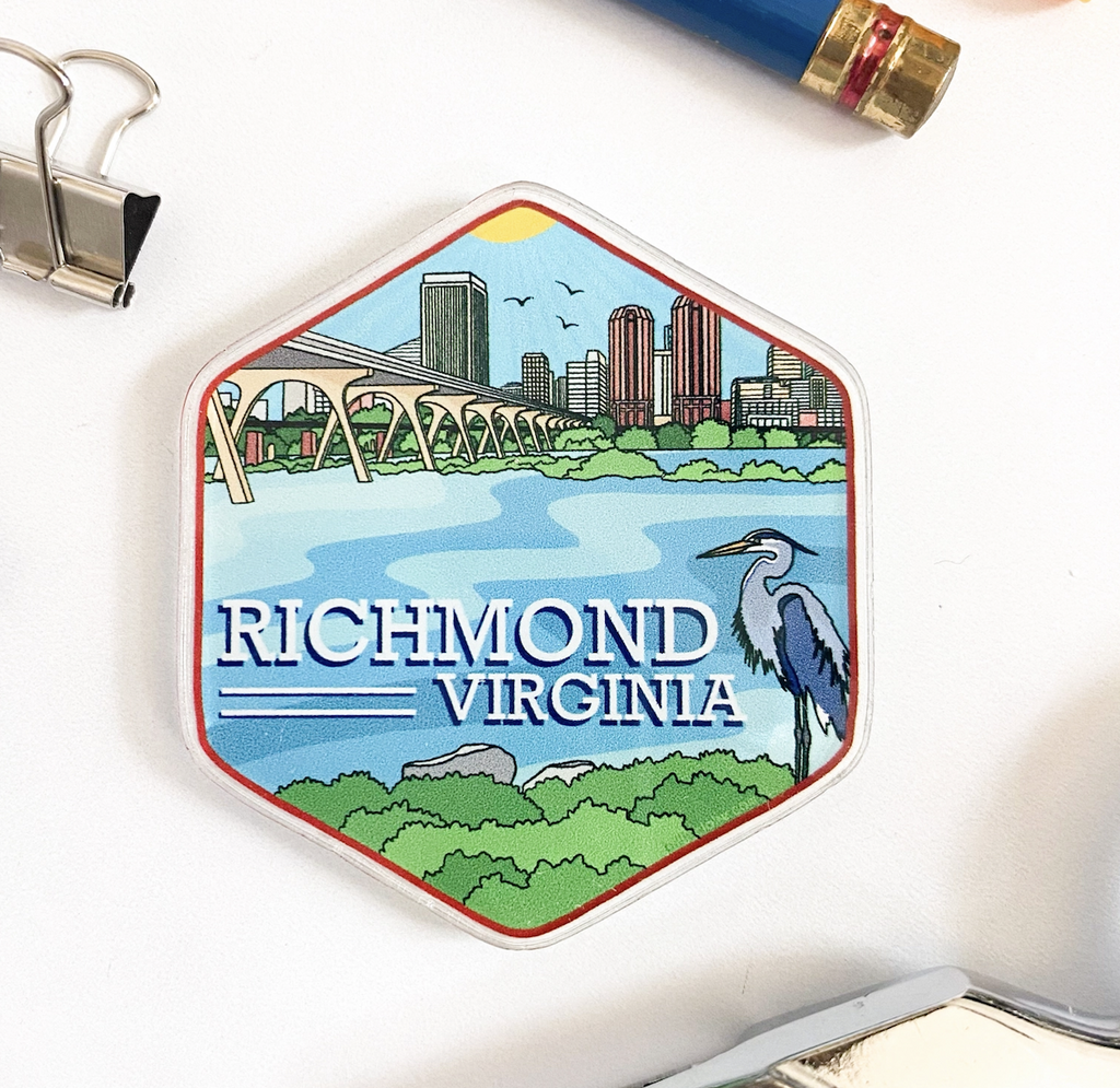 Acrylic magnet featuring the Richmond, Virginia city skyline in full color. The drawing features the Manchester Bridge over the James River with a blue heron in the foreground. 
