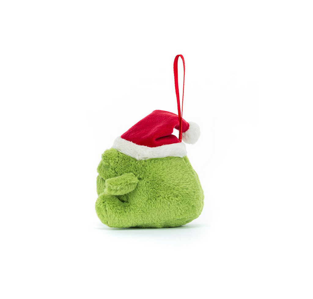 Side view of the stuffed animal Ricky Rain Frog wearing a Santa hat with a red ribbon to hang him. 